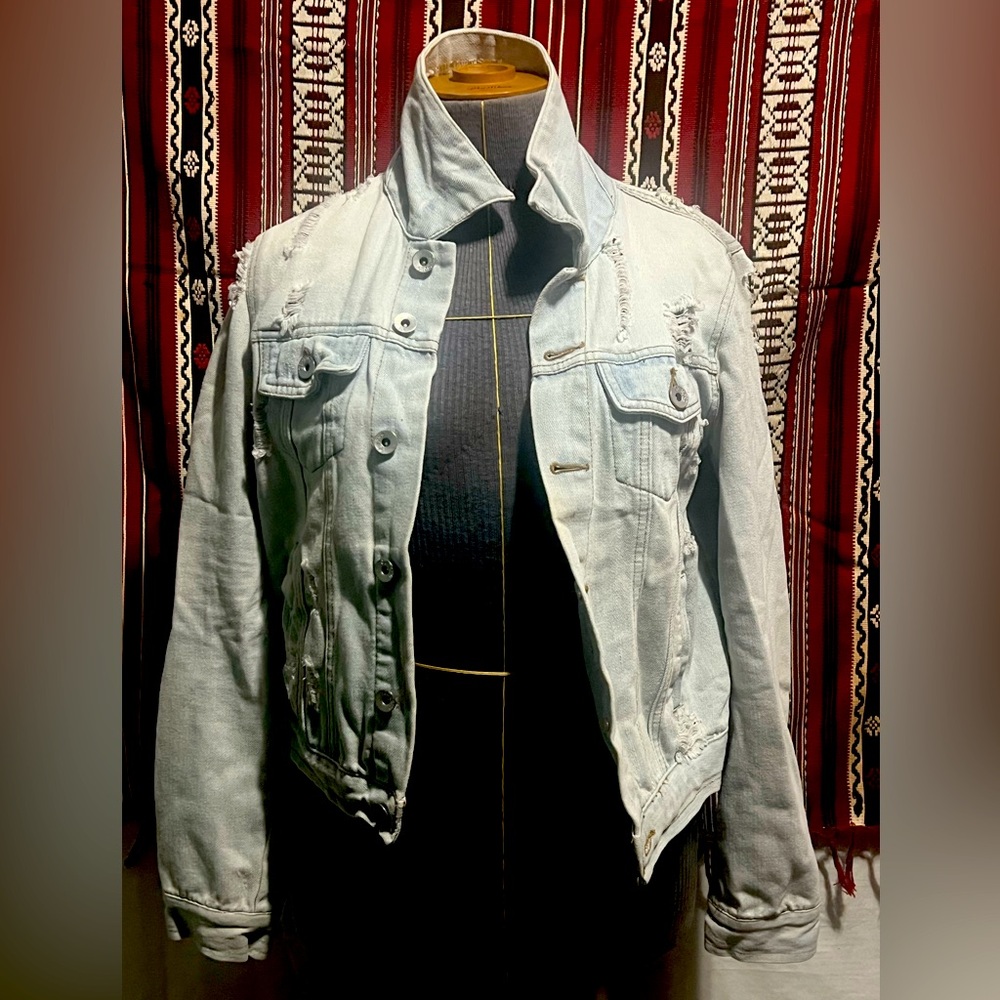 Women’s distressed white jean jacket